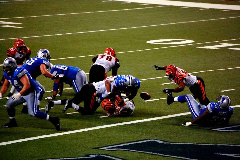 The offensive line protects the quarterback and creates openings for running backs.